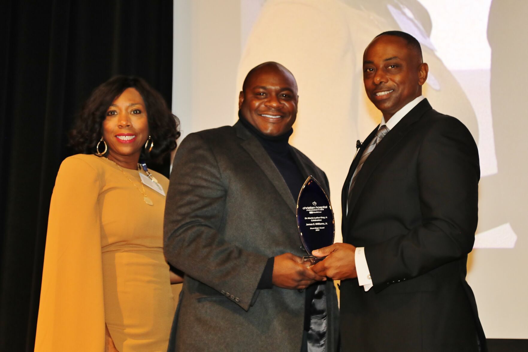 Necole Cheung, Greg Mosley (accepting award for James Williams, Jr.), Rick Stevens